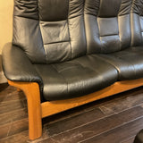 Ekorness Stressless Buckingham High-Back Reclining Sofa and Storage Ottoman