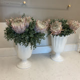 Pair of White Scalloped Vases with Flowers