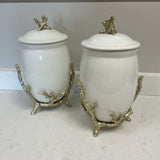 Pair of White Canisters on Coral Stands